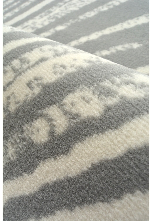 Stylish swirl pattern rug for modern interiors.