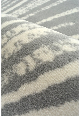 Stylish swirl pattern rug for modern interiors.