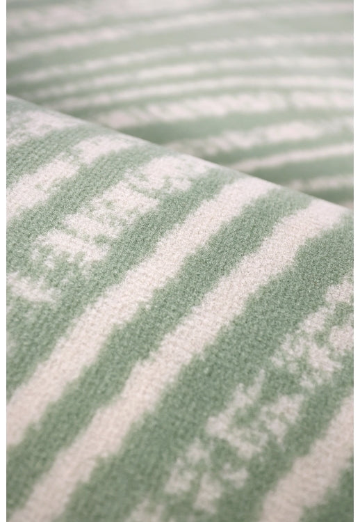 Contemporary rug with subtle swirl detailing.