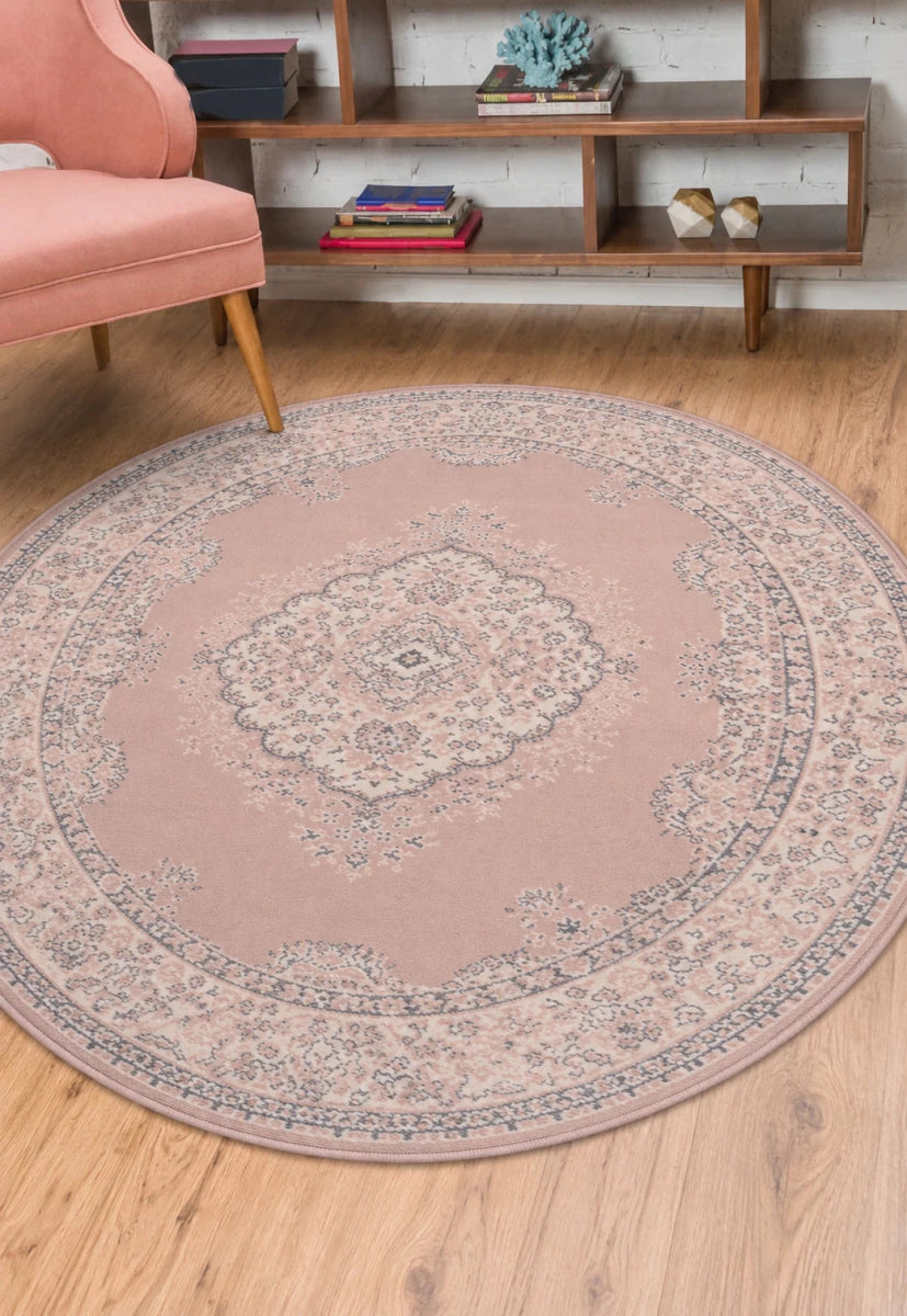 Round blush rug with soft elegant modern design.