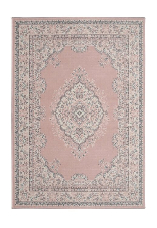 Soft pink rug adding warmth and sophistication.