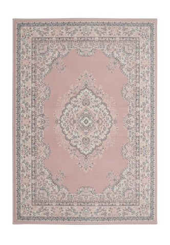 Soft pink rug adding warmth and sophistication.