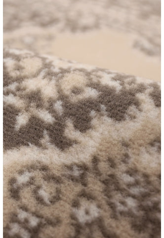 Round neutral rug with soft durable finish.