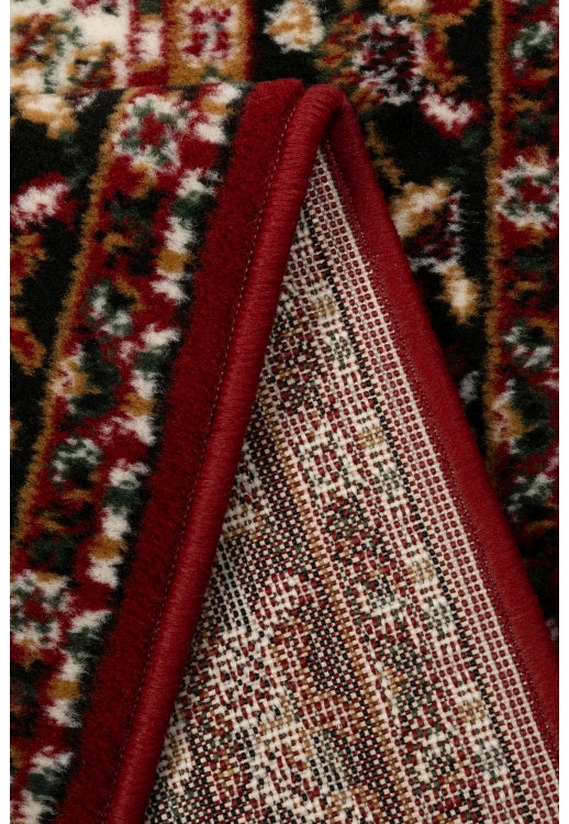 Red rug with timeless traditional design.