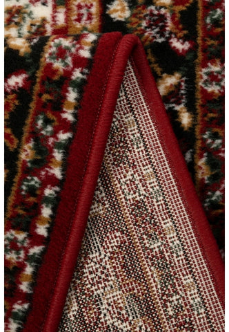Red rug with timeless traditional design.