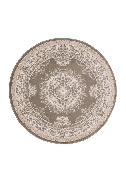 Circular rug in soft taupe tones for elegant interiors.