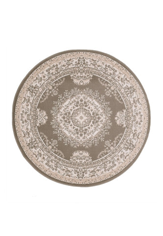Circular rug in soft taupe tones for elegant interiors.