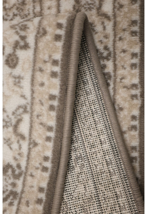 Round taupe rug with soft durable low pile finish.