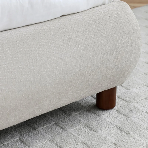 Close Up of Wooden Legs on the Mallow Fabric Upholstered Bed 