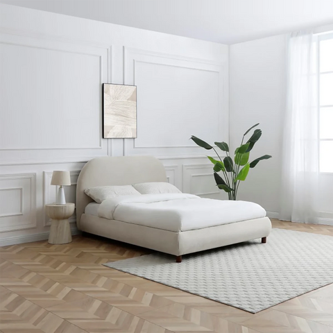 Lifestyle image of Mallow Fabric Upholstered Bed with Walnut Legs. Available in a Double or King 