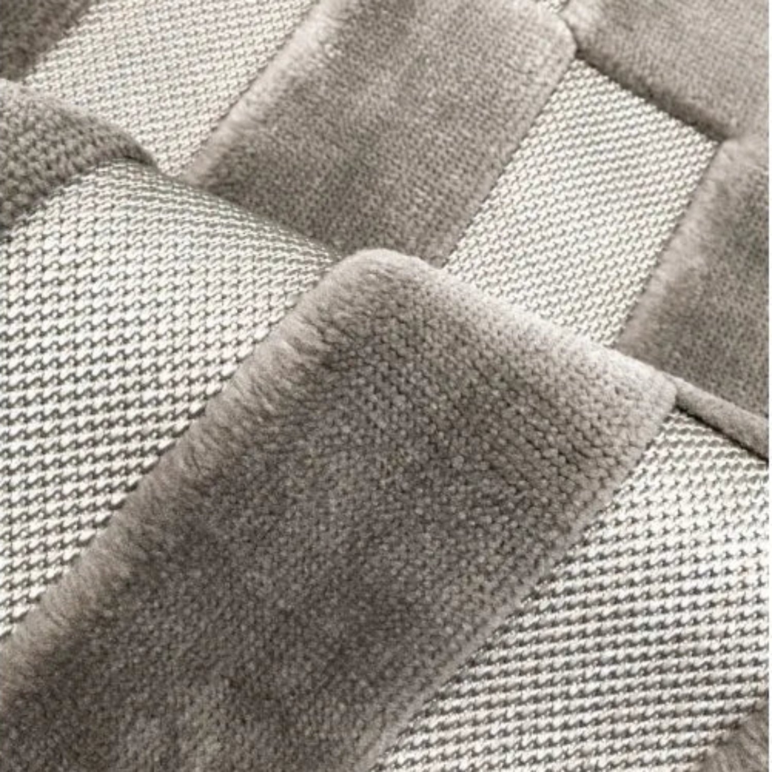 Modern grey rug with subtle patterned detailing.
