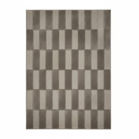 Grey rug with modern block pattern and textured design.