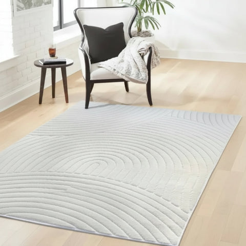 Modern rug with flowing curved pattern and subtle design.