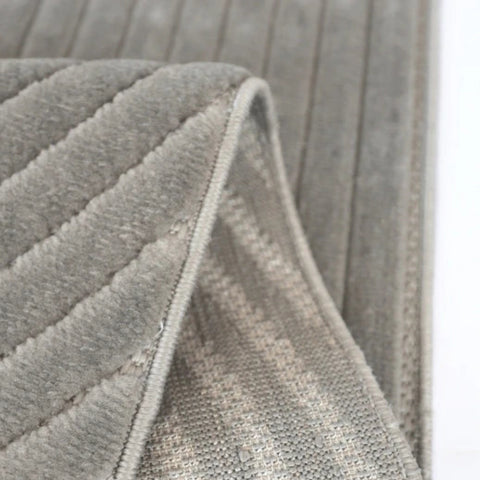 Machine woven rug with durable and easy care fabric.