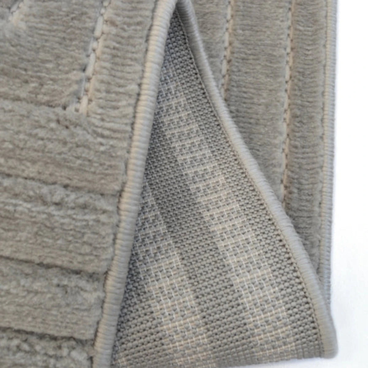 Textured rug with maze pattern and 3D effect.