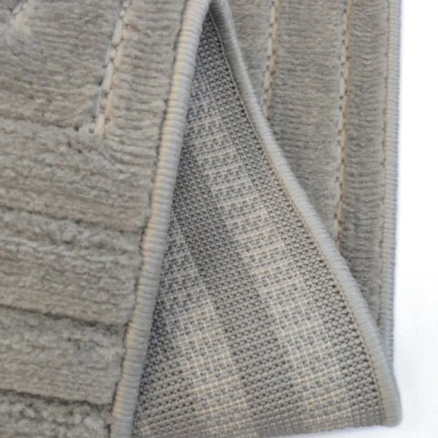 Textured rug with maze pattern and 3D effect.