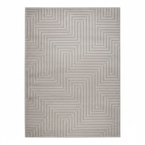Modern grey rug with intricate geometric maze design.