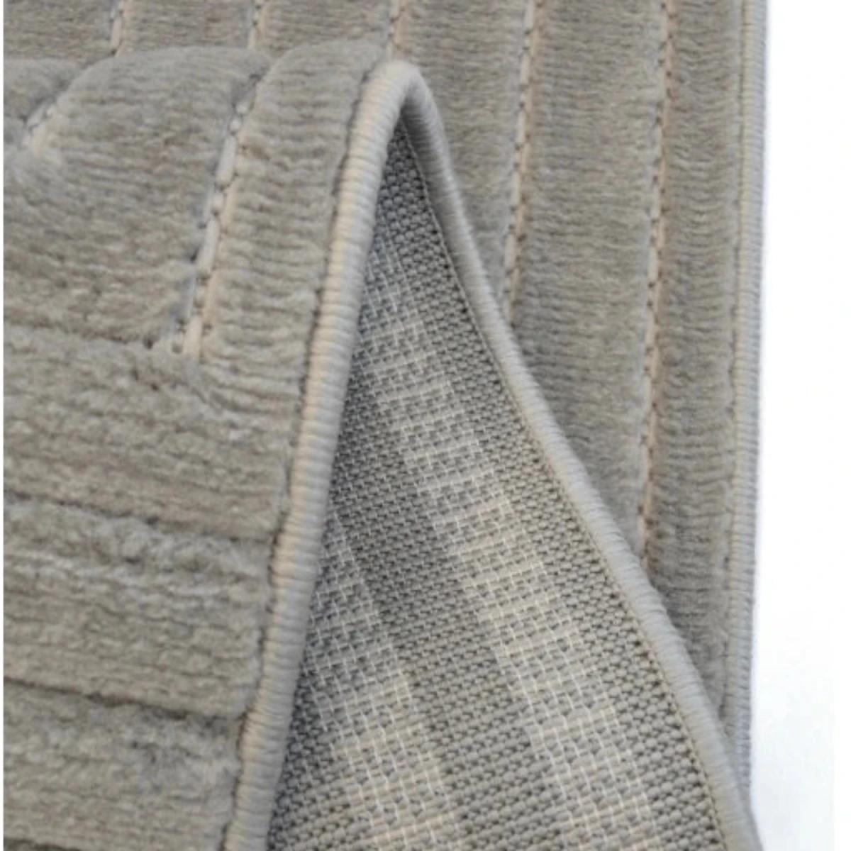 Contemporary rug with tone on tone square detailing.