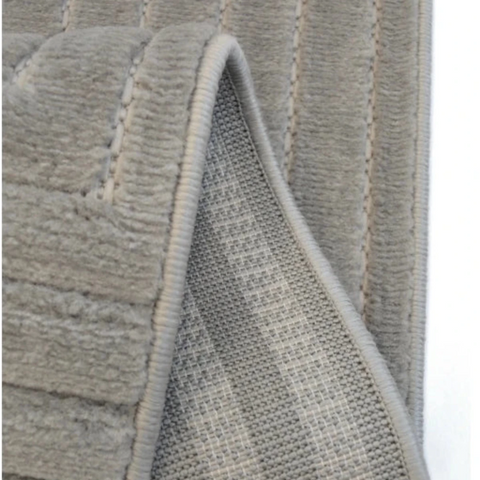 Contemporary rug with tone on tone square detailing.