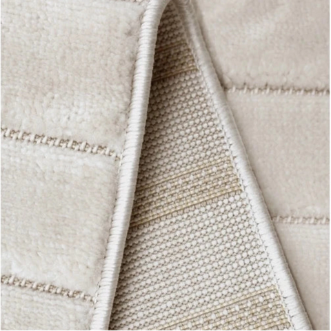 Contemporary rug with tone on tone stripe detailing.