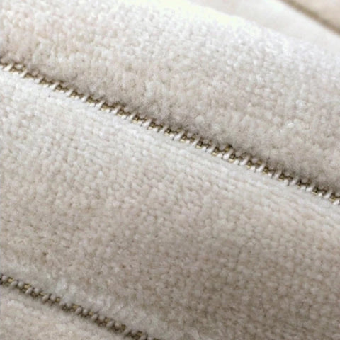 Stylish striped rug adding depth and softness.