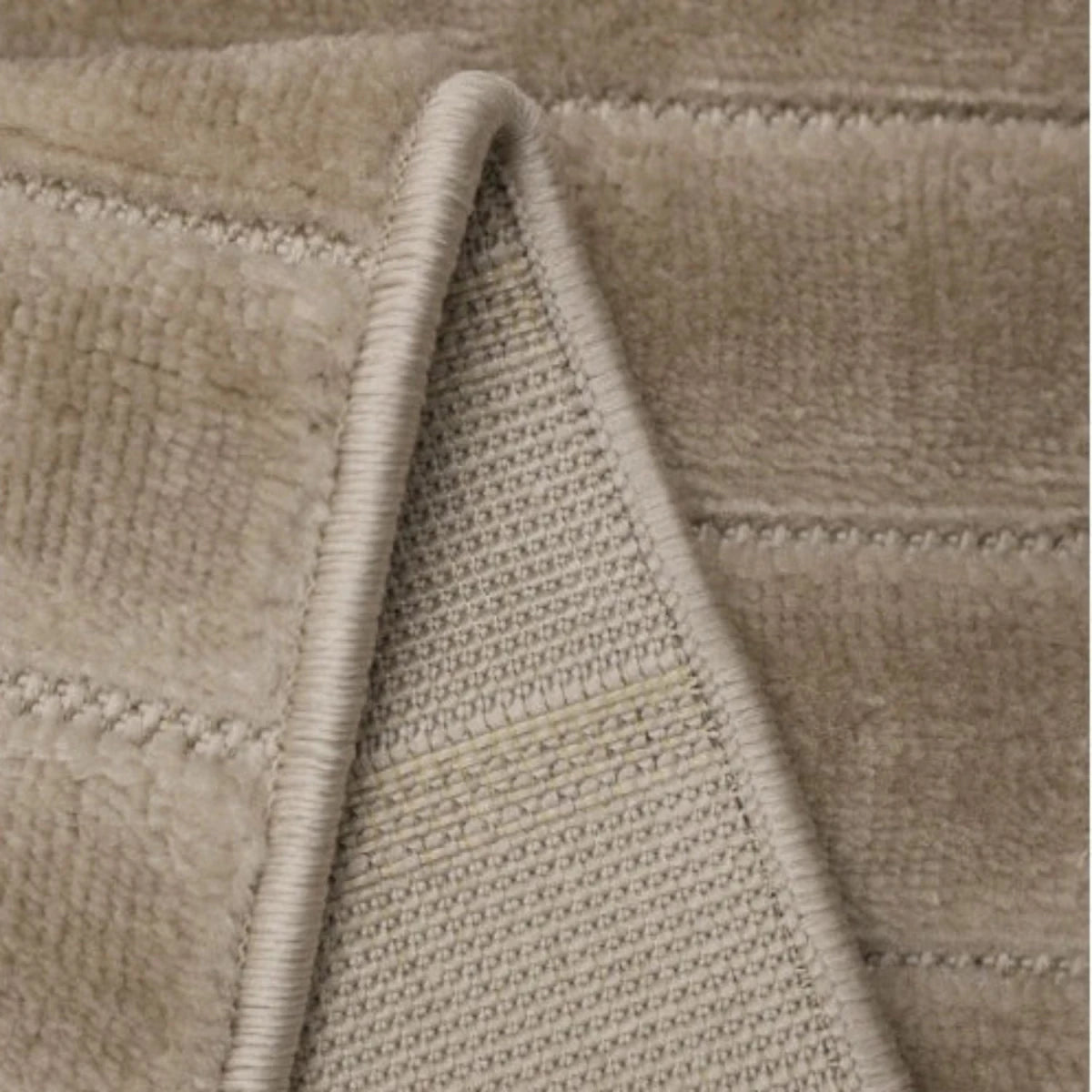 Stylish striped rug adding depth and softness.