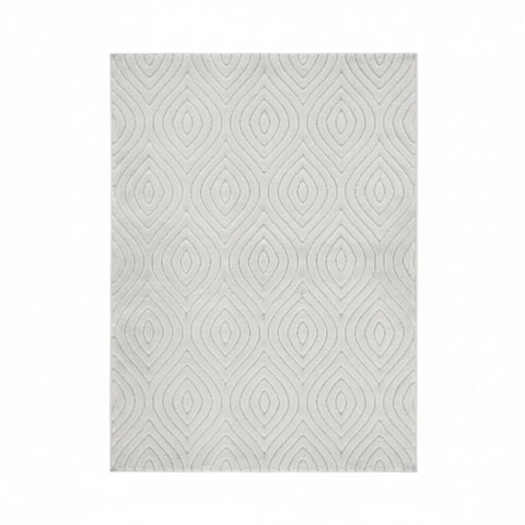 Textured rug with tear drop pattern and 3D effect.