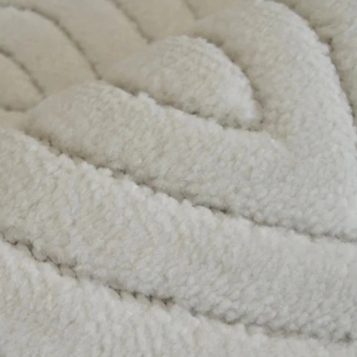 Contemporary rug with tone on tone teardrop detailing.