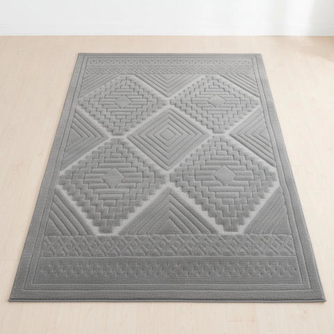 Grey rug with tribal inspired pattern and modern design.