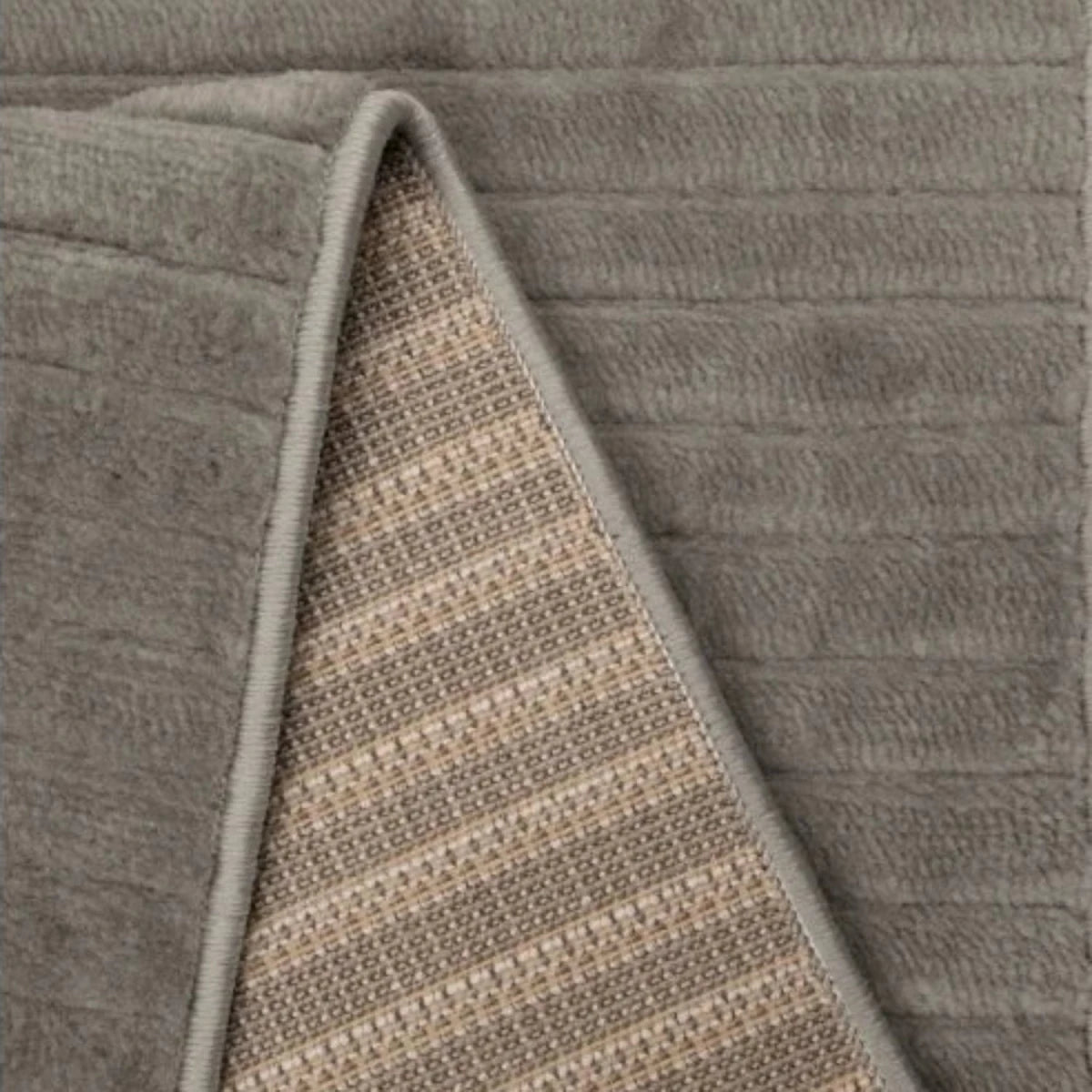 Contemporary rug with tone on tone wave detailing.