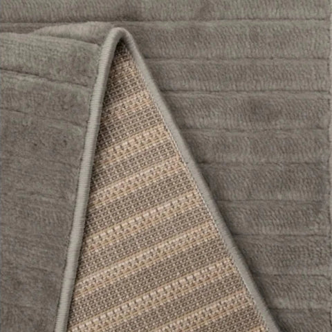 Contemporary rug with tone on tone wave detailing.