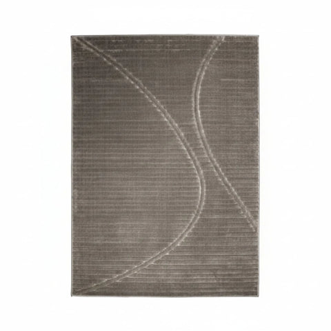 Stylish rug with wave inspired pattern adding movement.