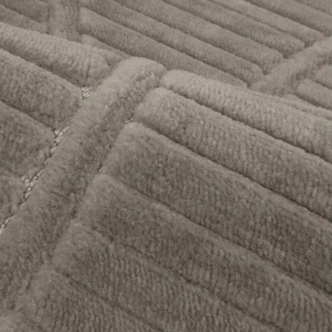 Modern grey rug with soft flowing wave design.