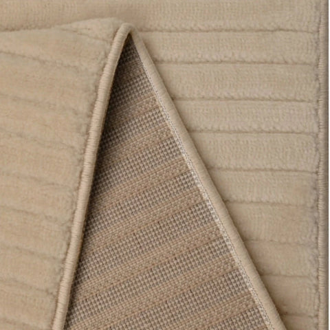 Textured rug with wave pattern and 3D effect.