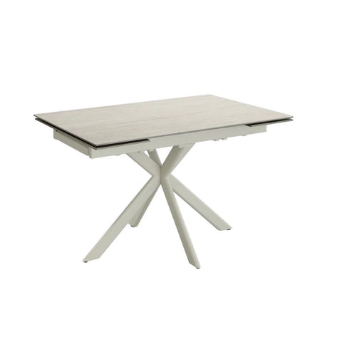 Modern dining table with a white base and light-colored top on a white background