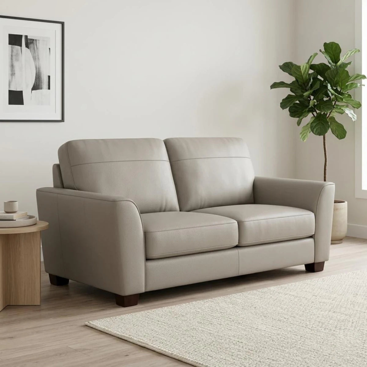 Stylish two-seater leather sofa with deep seating and sleek look.