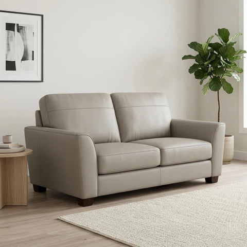 Stylish two-seater leather sofa with deep seating and sleek look.