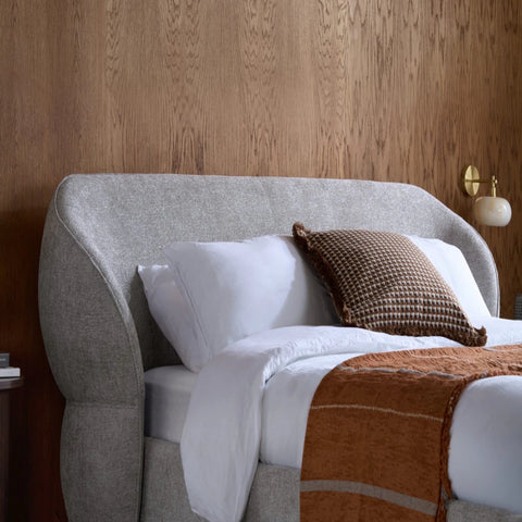 Artistic headboard design with smooth flowing curves.