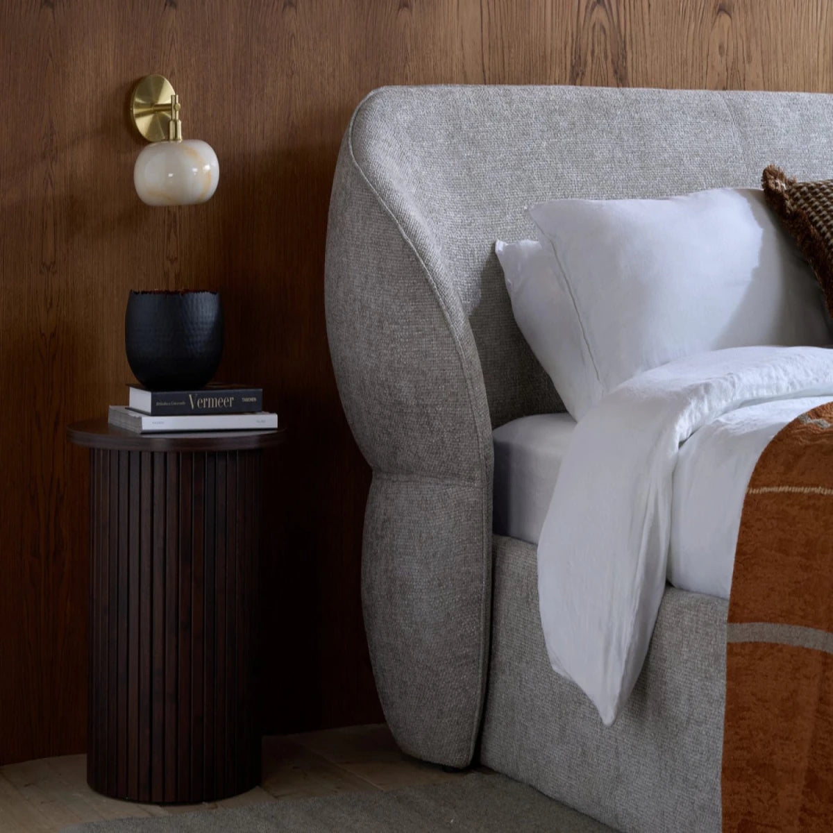 Contemporary curved headboard with elegant structure.