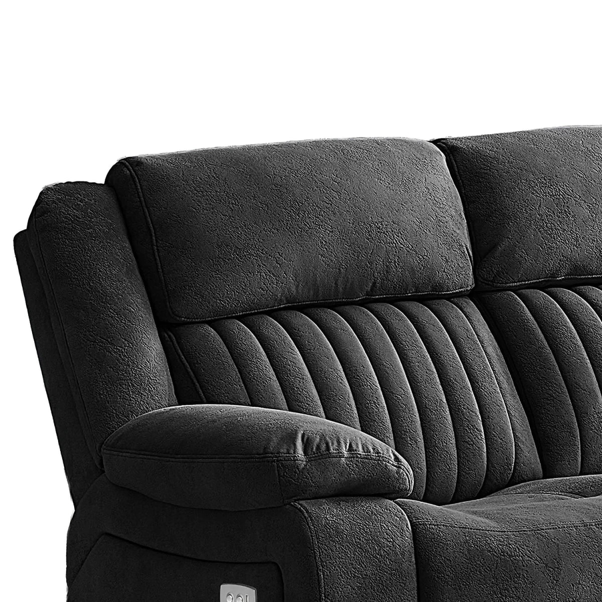 Close-up of a dark gray upholstered reclining sofa showing the padded backrest, ribbed seat cushions, and armrest against a plain white background.