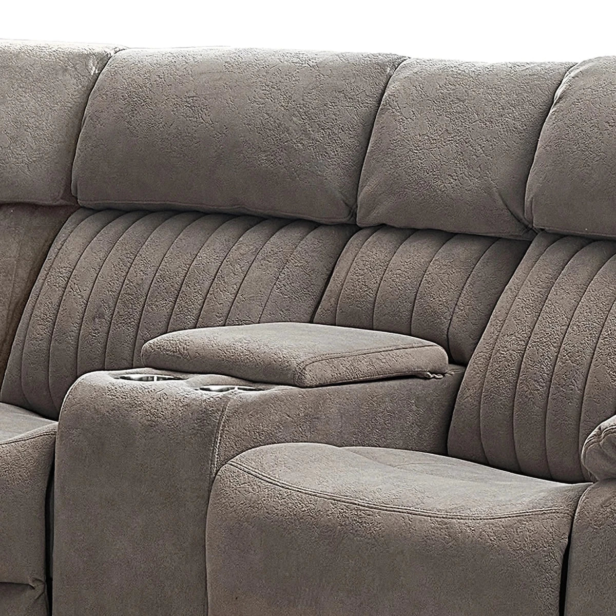 Close-up of a pMorgan Fabric Large Electric Recliner Corner Suite with Cup Holders with padded back cushions, ribbed armrests, and a center console cup holder.