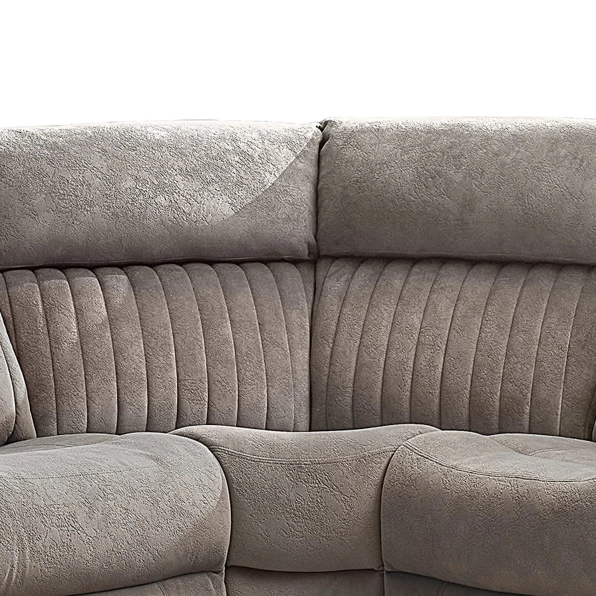 Close-up of a Taupe corner upholstered sofa section with ribbed vertical channel tufting on the backrest and seat cushions.