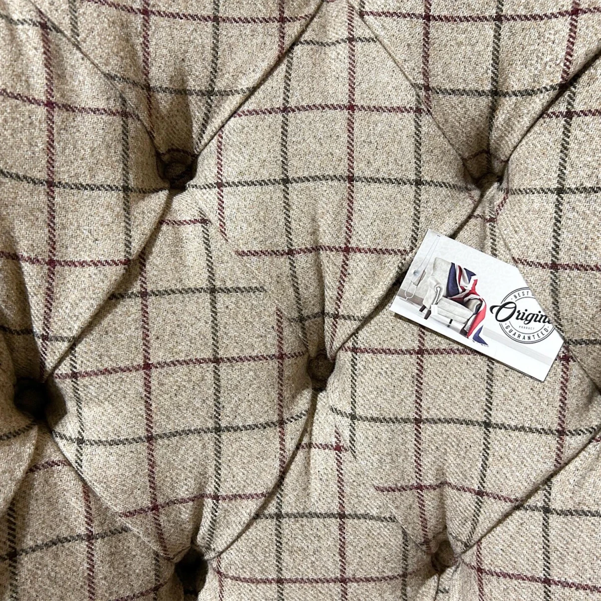 Close up of Oswald and Pabo Beige Check & Tan Leather Wing Chair