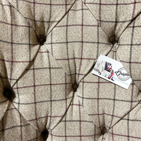 Close up of Oswald and Pabo Beige Check & Tan Leather Wing Chair