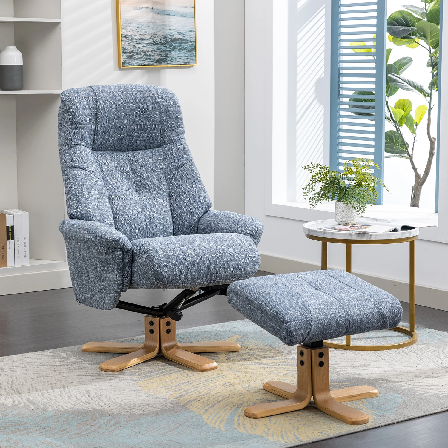 A blue-gray muscat upholstered recliner chair with a matching ottoman, shown in a bright modern living room. The chair and ottoman have a textured woven fabric, wooden star-shaped legs, and a black swivel base.