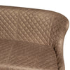 Close-up of a quilted upholstered dining bench in a warm taupe-brown color, showing the diamond-stitched texture and curved armrest against a plain white background.