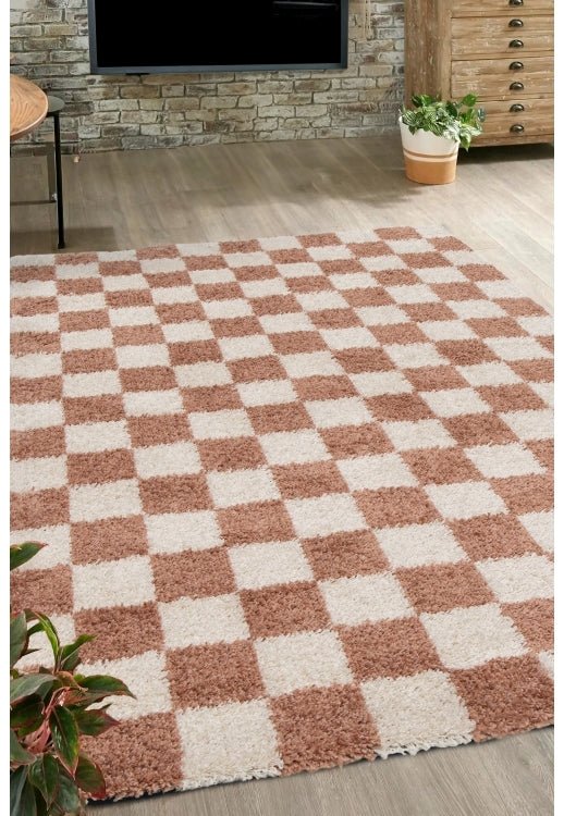 Terracotta check rug with soft shaggy high pile.
