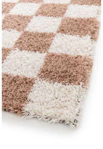 Soft plush rug in terracotta tones for cozy spaces.