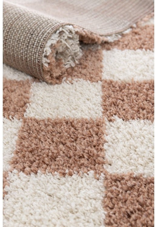 Check pattern rug with thick high pile texture.