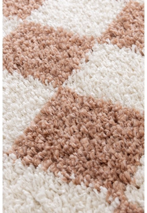 Terracotta shaggy rug adding warmth and depth.